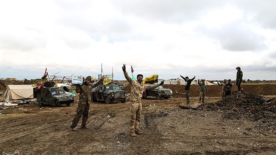 Popular Mobilization Forces vehicles and fighters